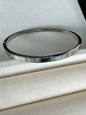 CHANEL Silver Logo Hinged Bangle